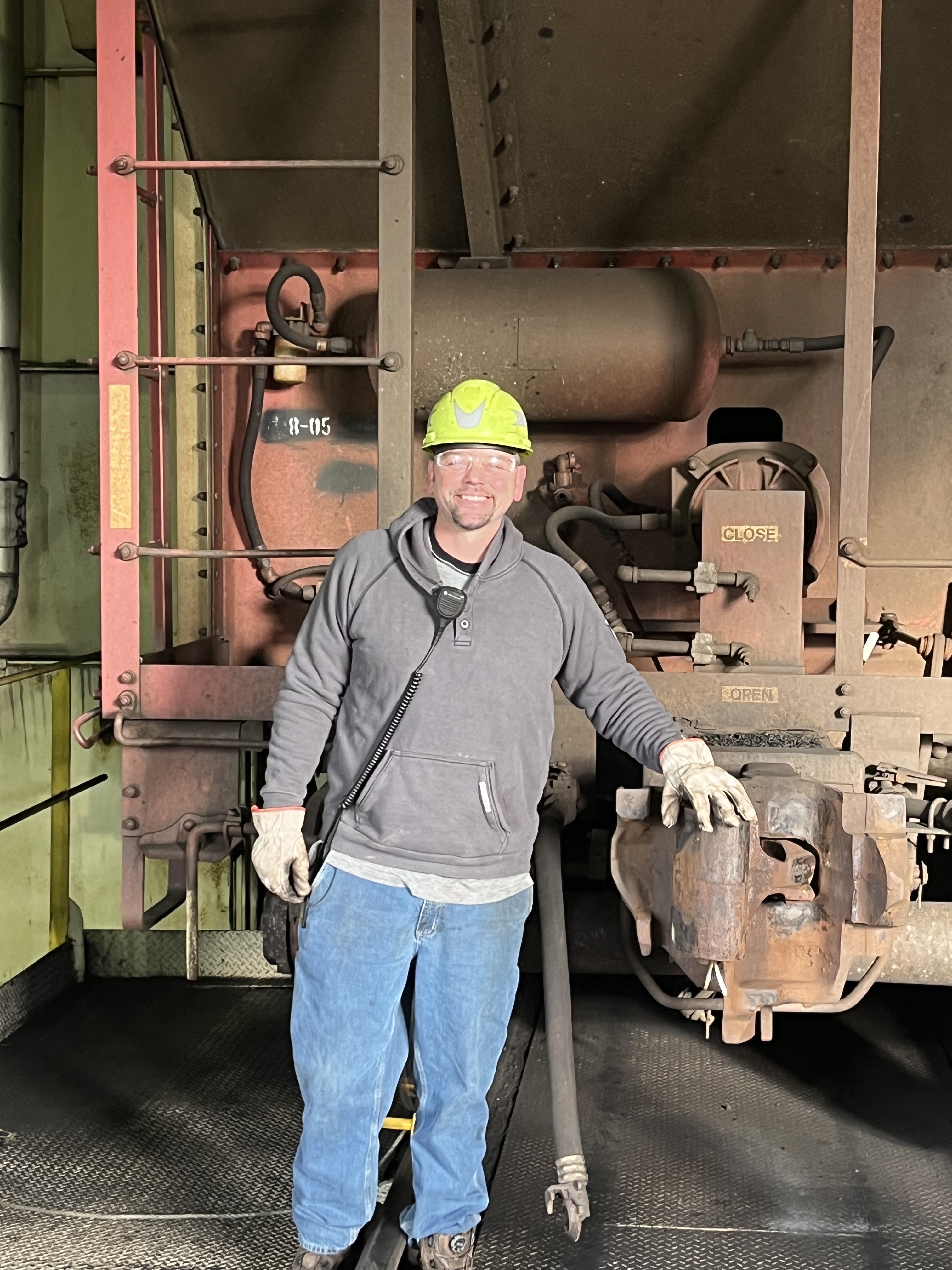 man leaning against coal car