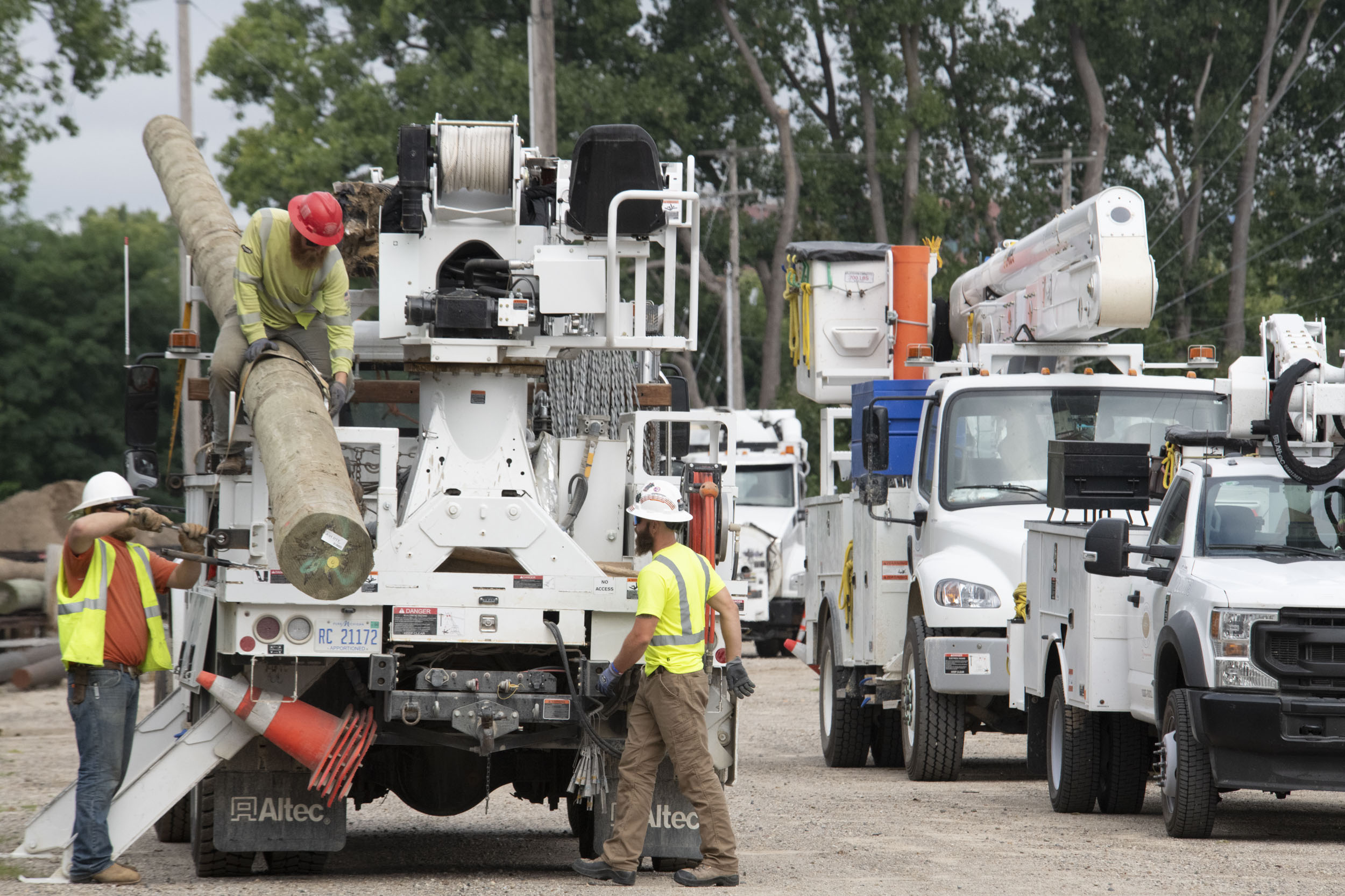 line trucks with workers around