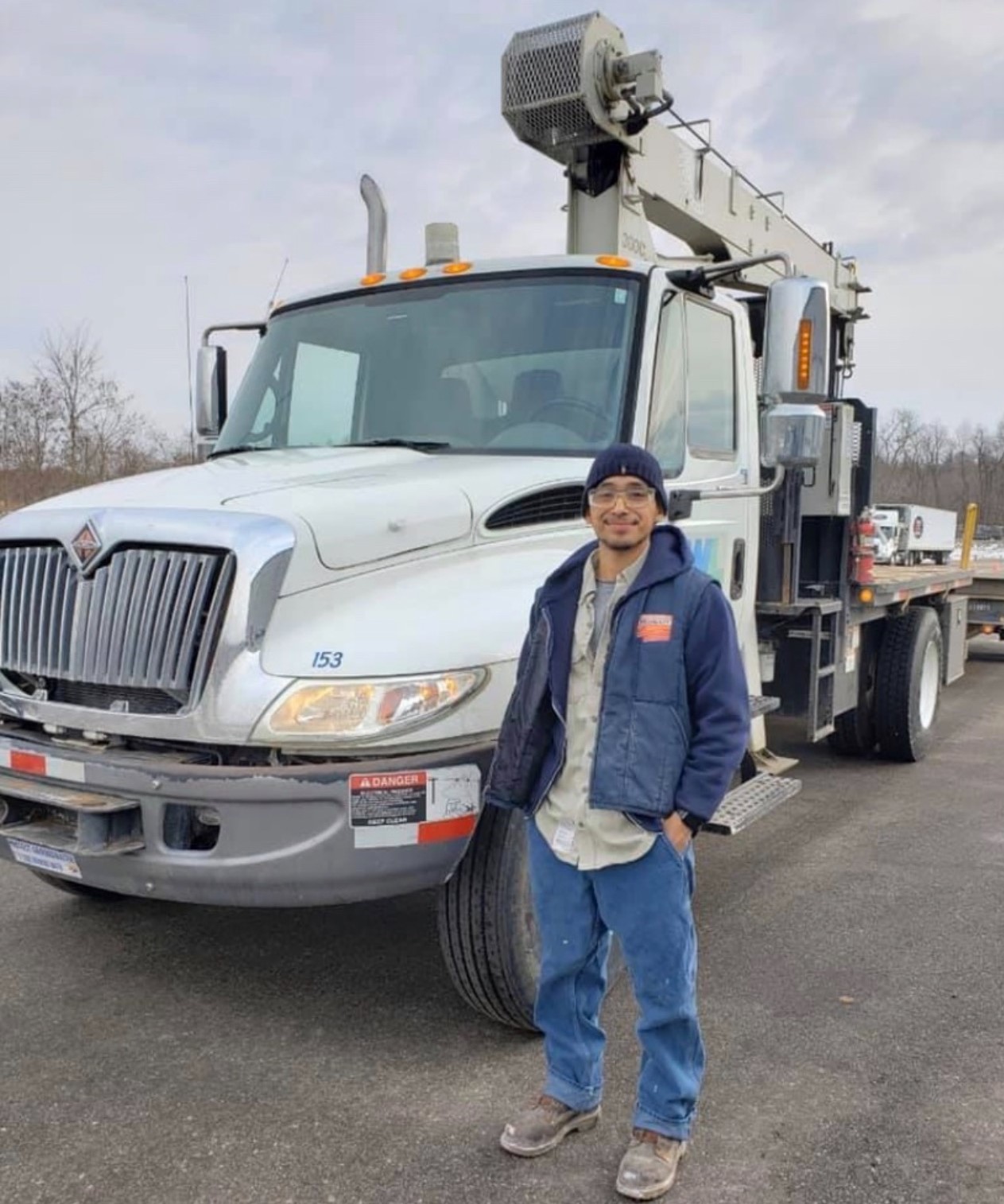 man standing in front of line truck