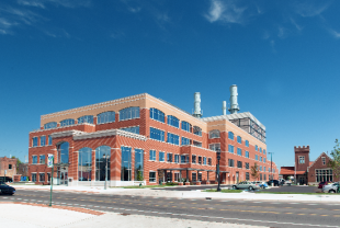 brick building with blue sky behind