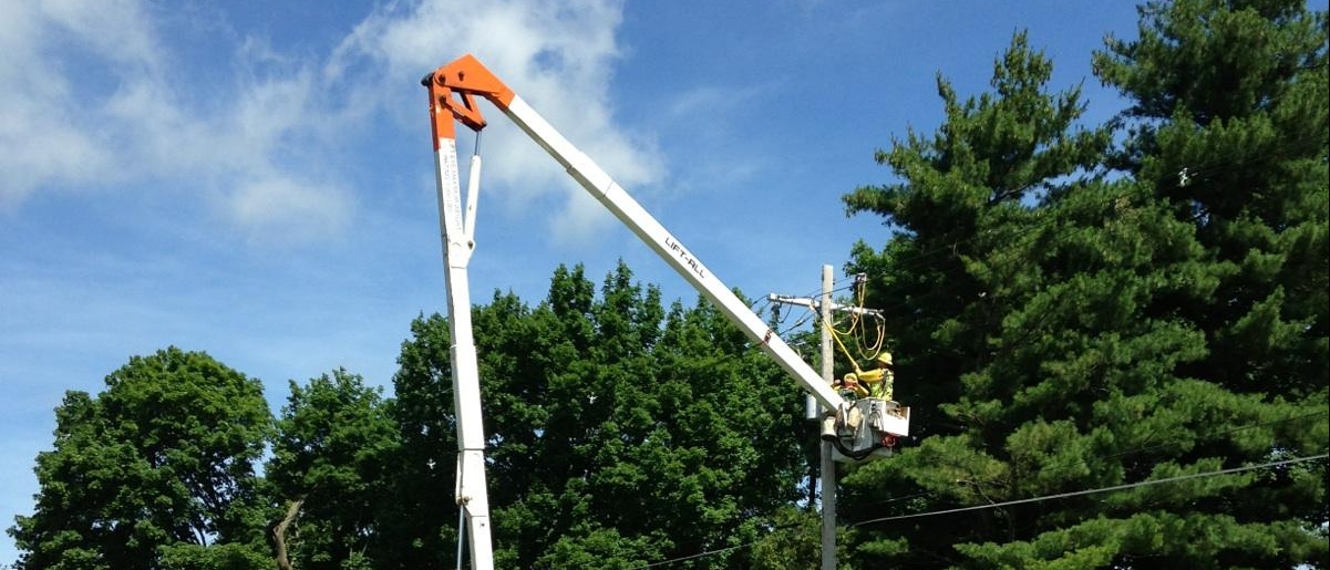 A lineman works on a power line. 