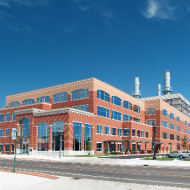brick building with blue sky behind